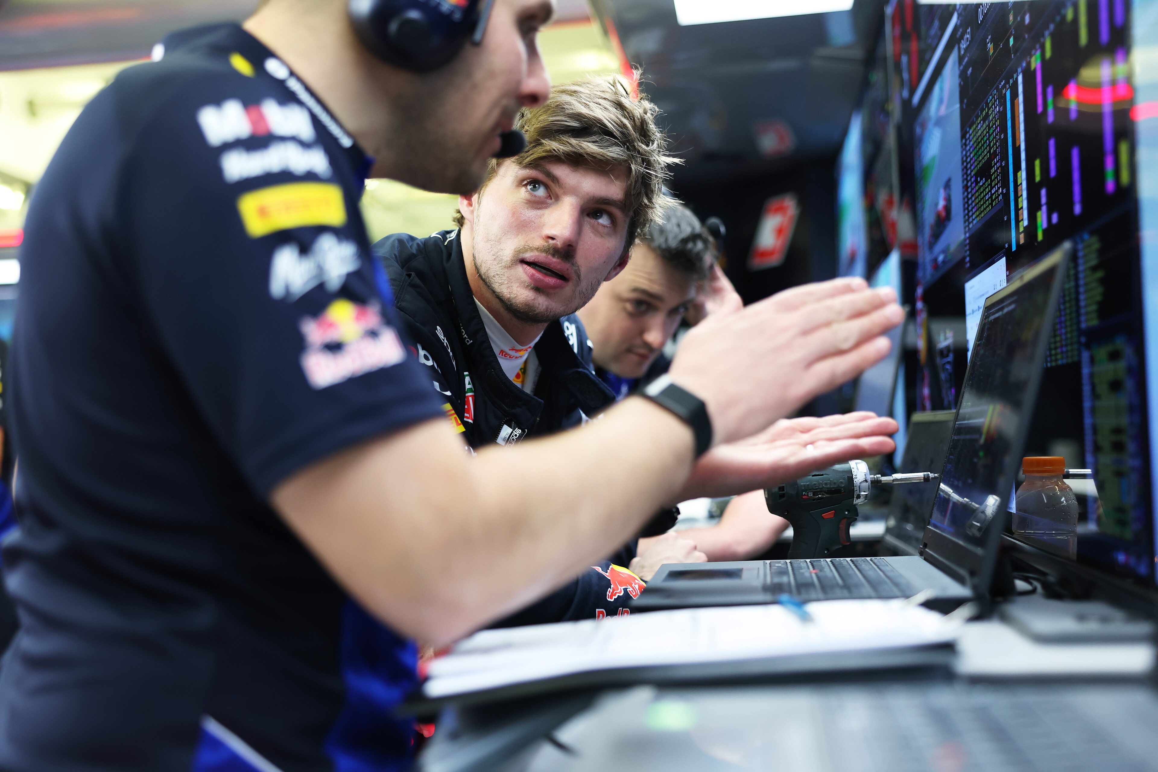 Max Verstappen of the Netherlands and Oracle Red Bull Racing talks in the garage during day two of F1 Testing at Bahrain International Circuit on February 19, 2026 in Bahrain, Bahrain. PHOTO CREDIT: Red Bull Media House. 